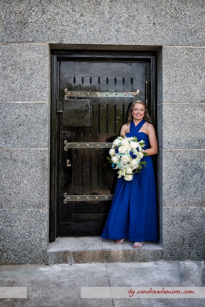 A lesbian bride poses for her gay wedding photos at the Dingle Tower in Halifax, NS.