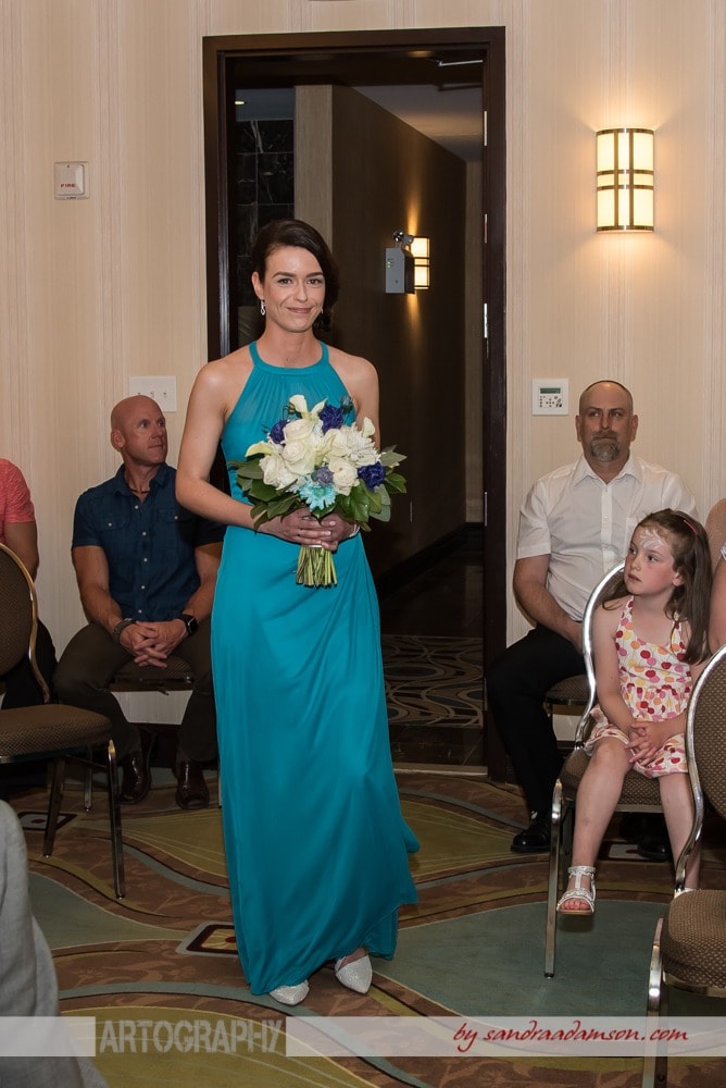 A lesbian bride walks up the aisle during her same sex gay wedding ceremony  at the Comfort Hotel Bayers Lake in Halifax, NS.