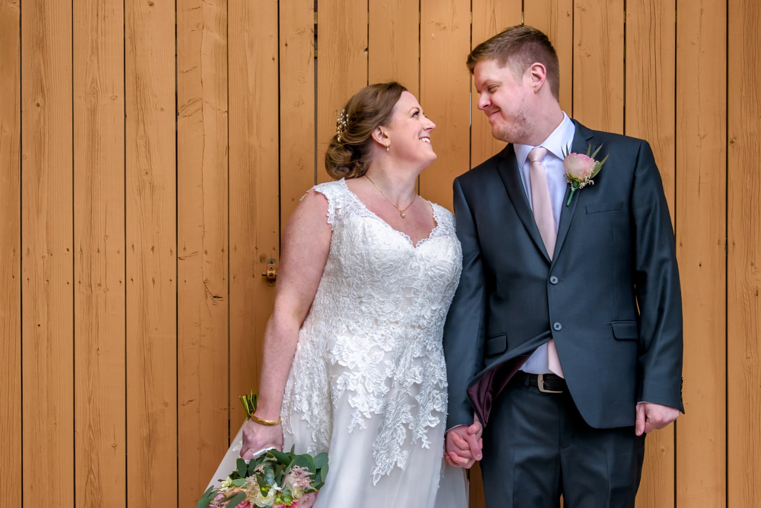 The bride and groom pose for wedding photos at the Best Western Chocolate Lake in Halifax, NS.