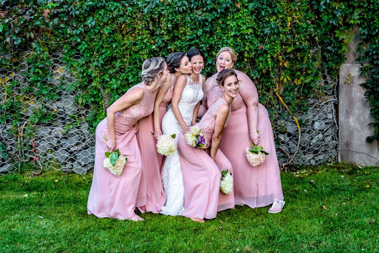 Fun bride with bridesmaids photos during an Old Orchard Inn wedding in the Annapolis Valley
