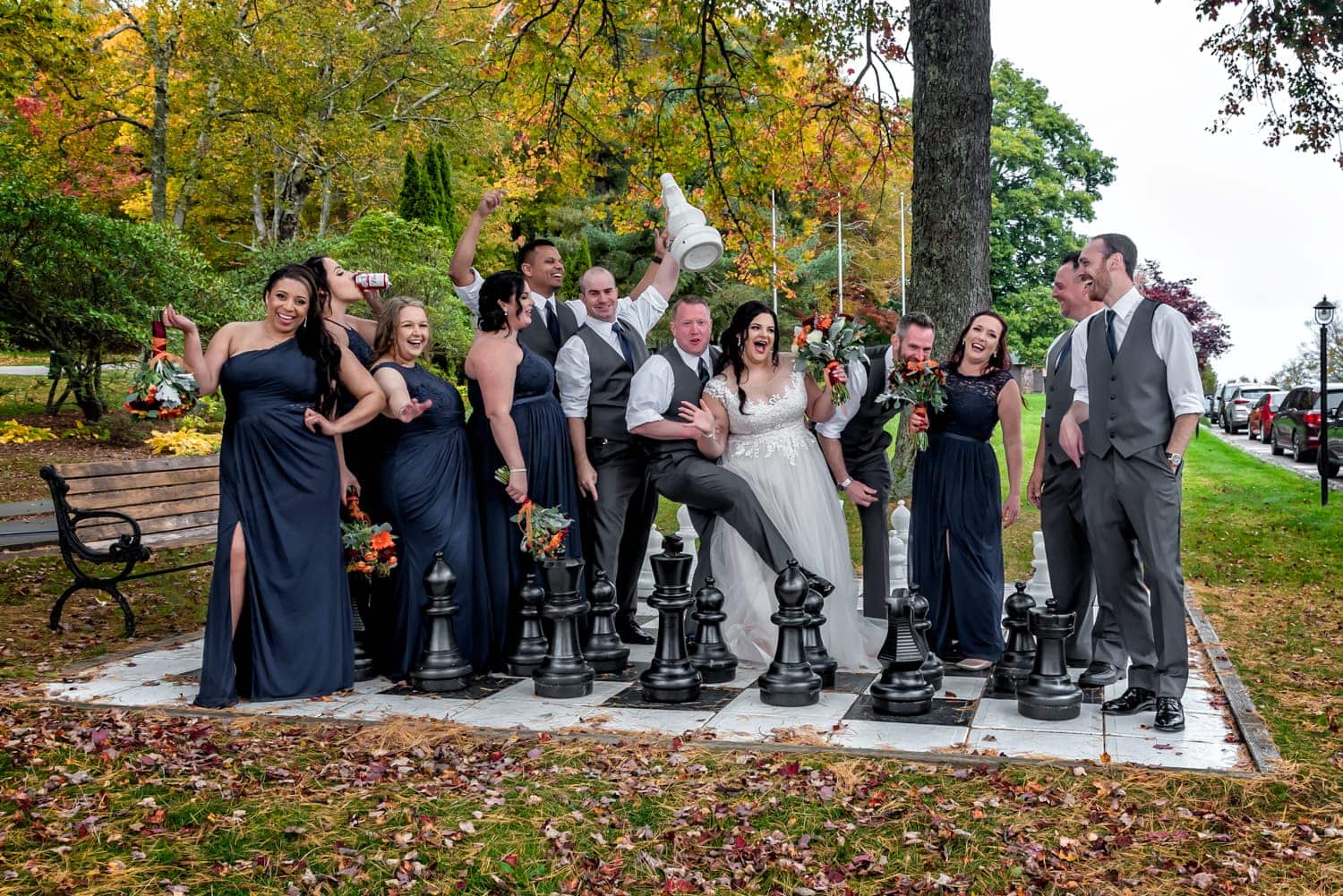 Funny wedding party photos at a Digby Pines wedding with the bride and groom on a giant chessboard.