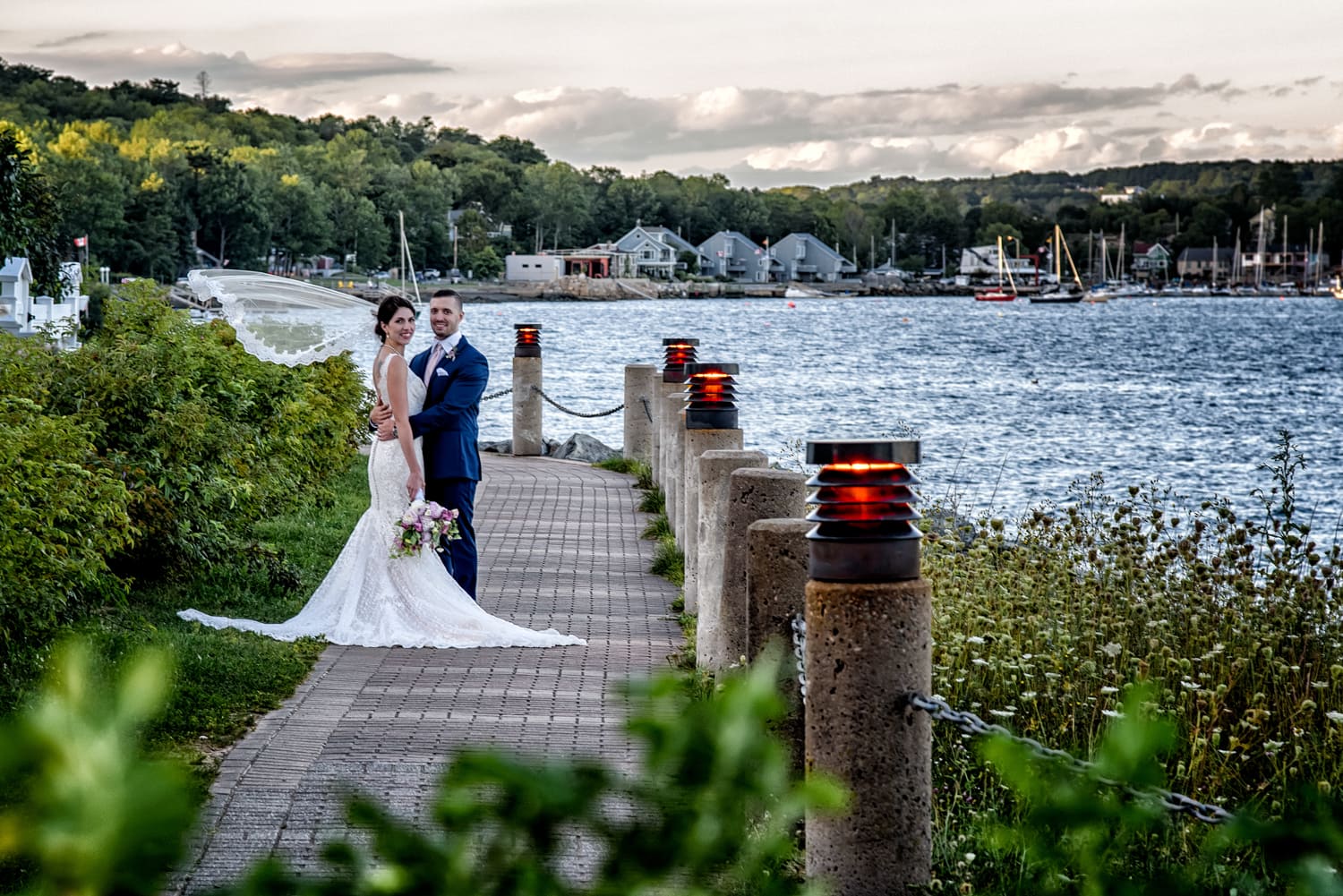 Halifax wedding photographer with the bride and groom for wedding photos on the halifax harbourfront in dewolfe park.