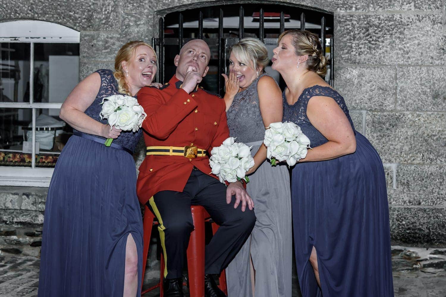 An RCMP groom with bridesmaids photos at Alexander Keiths Brewery in Halifax.