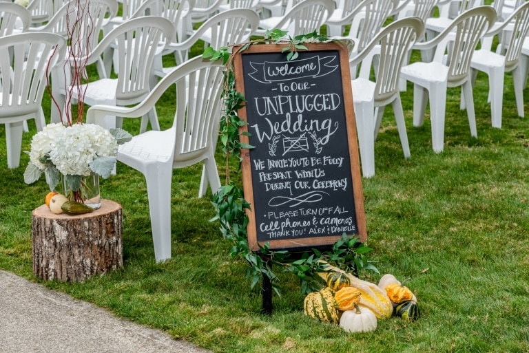 An unplugged ceremony sign welcoming the guests at the ceremony location at Digby Pines.