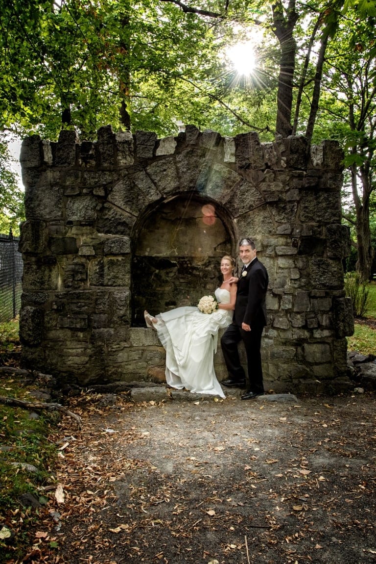The bride and groom wedding photos in the Halifax public gardens at sunset.