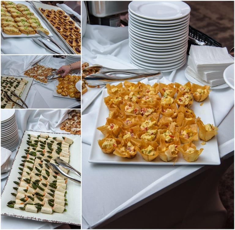 Food table with assorted appetizers, sandwiches, and desserts, perfect for wedding reception in Halifax.