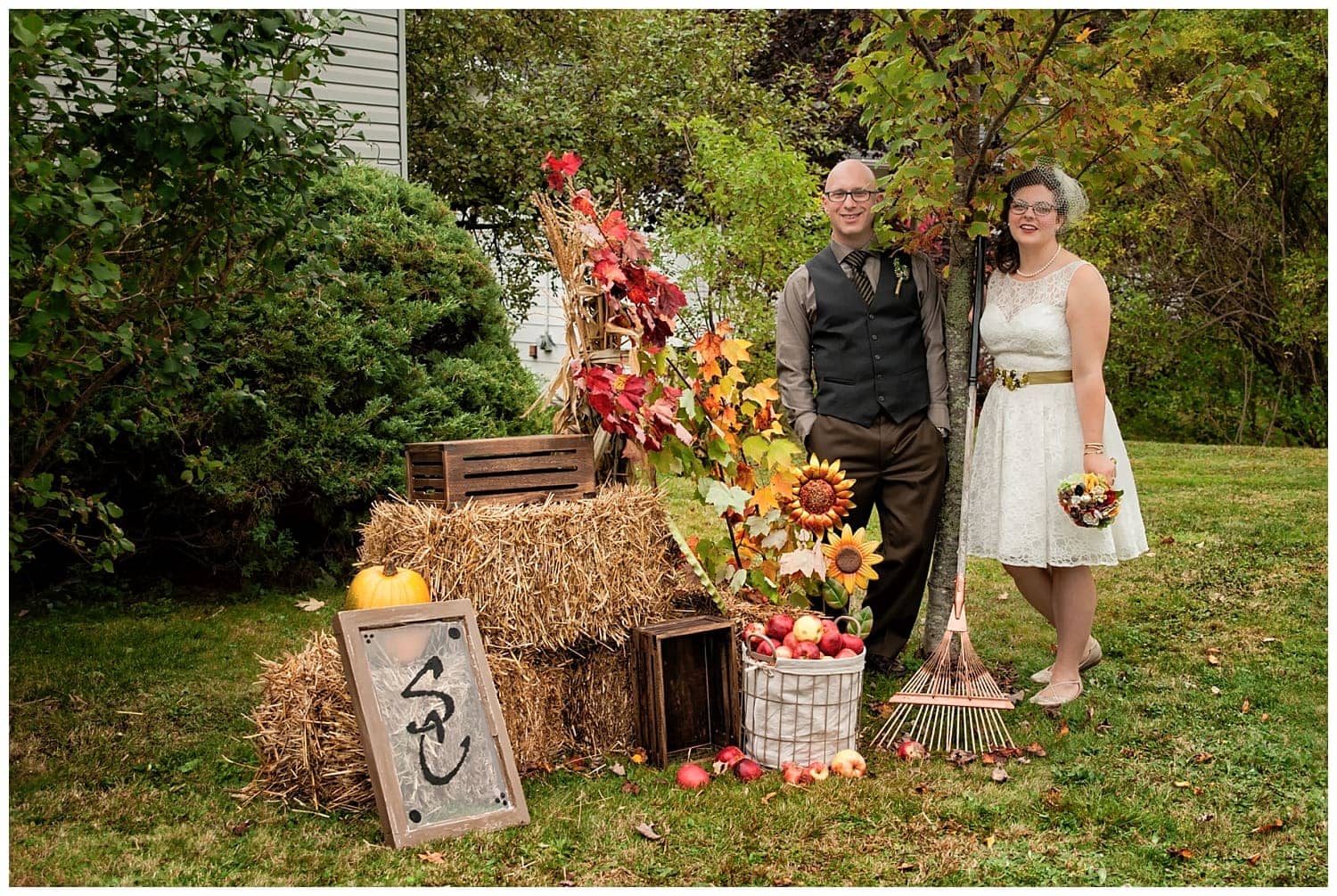 The bride and groom created a beautiful fall setting for their wedding photos during their backyard wedding in Dartmouth, NS.