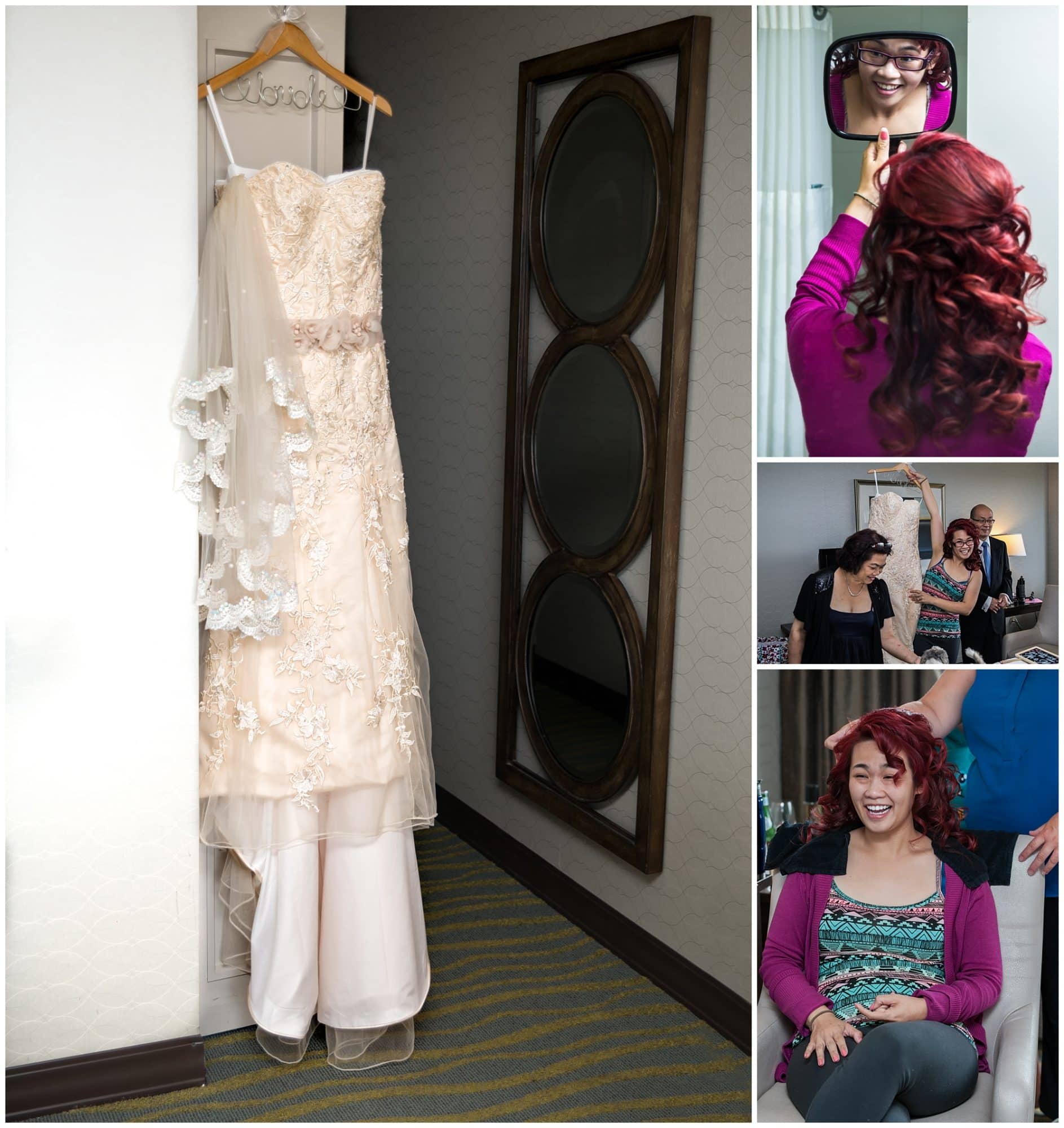 The wedding dress hangs from a door during the bride's bridal prep with her hair at the Atlantica Hotel in Halifax, NS.