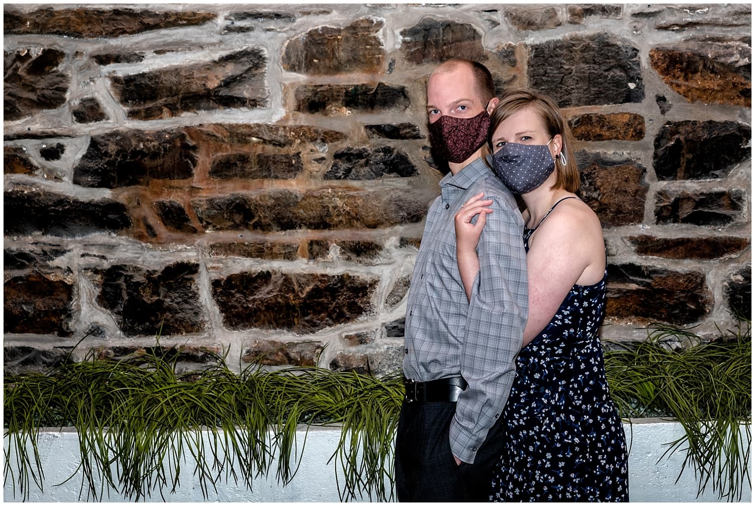 A couple pose for a covid engagement shoot at the Historic Properties in Halifax NS.