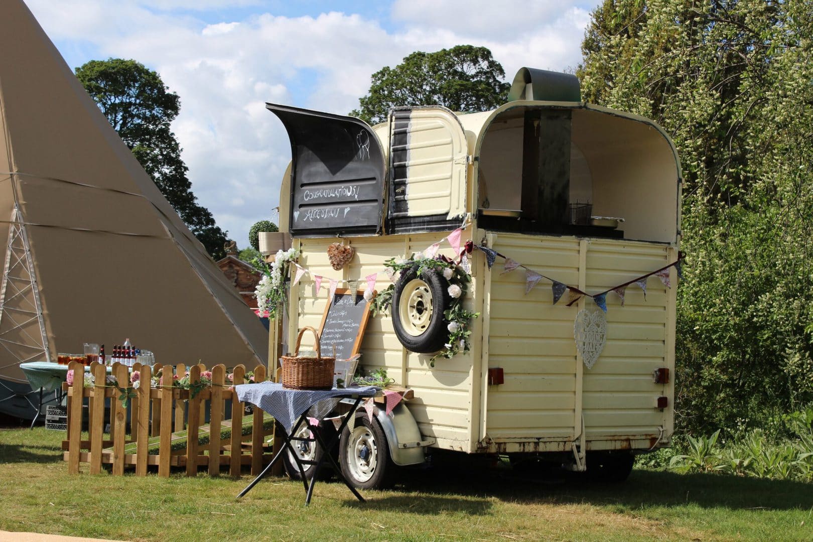 A cute horse carriage made into a food truck for weddings.