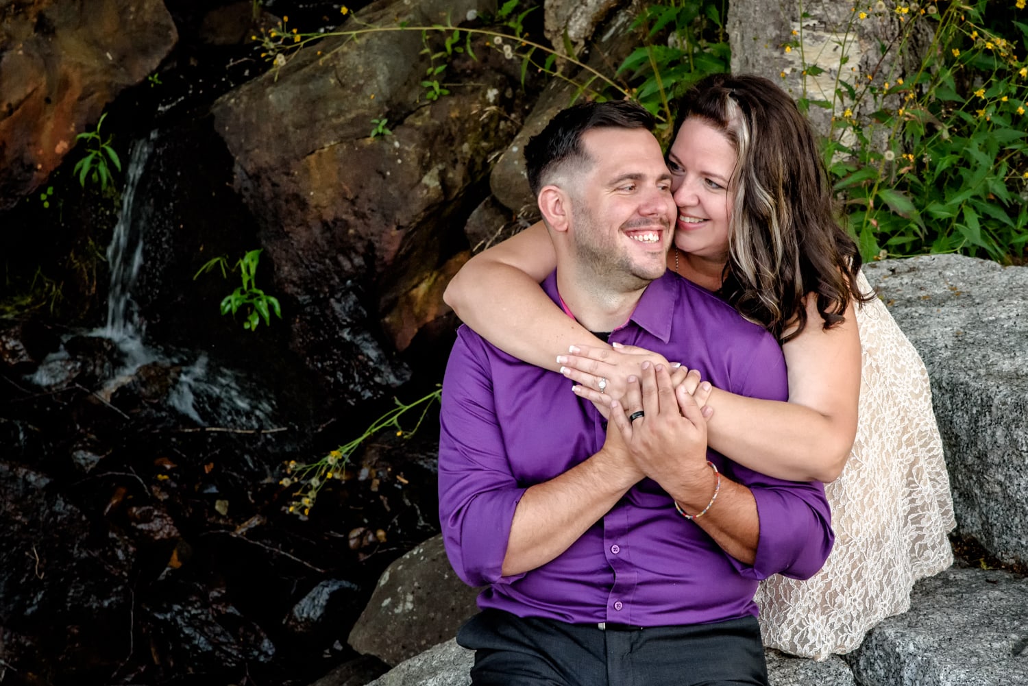 A couple in love embrace during their engagement photos at Sir Sandford Fleming Park in Halifax, NS.