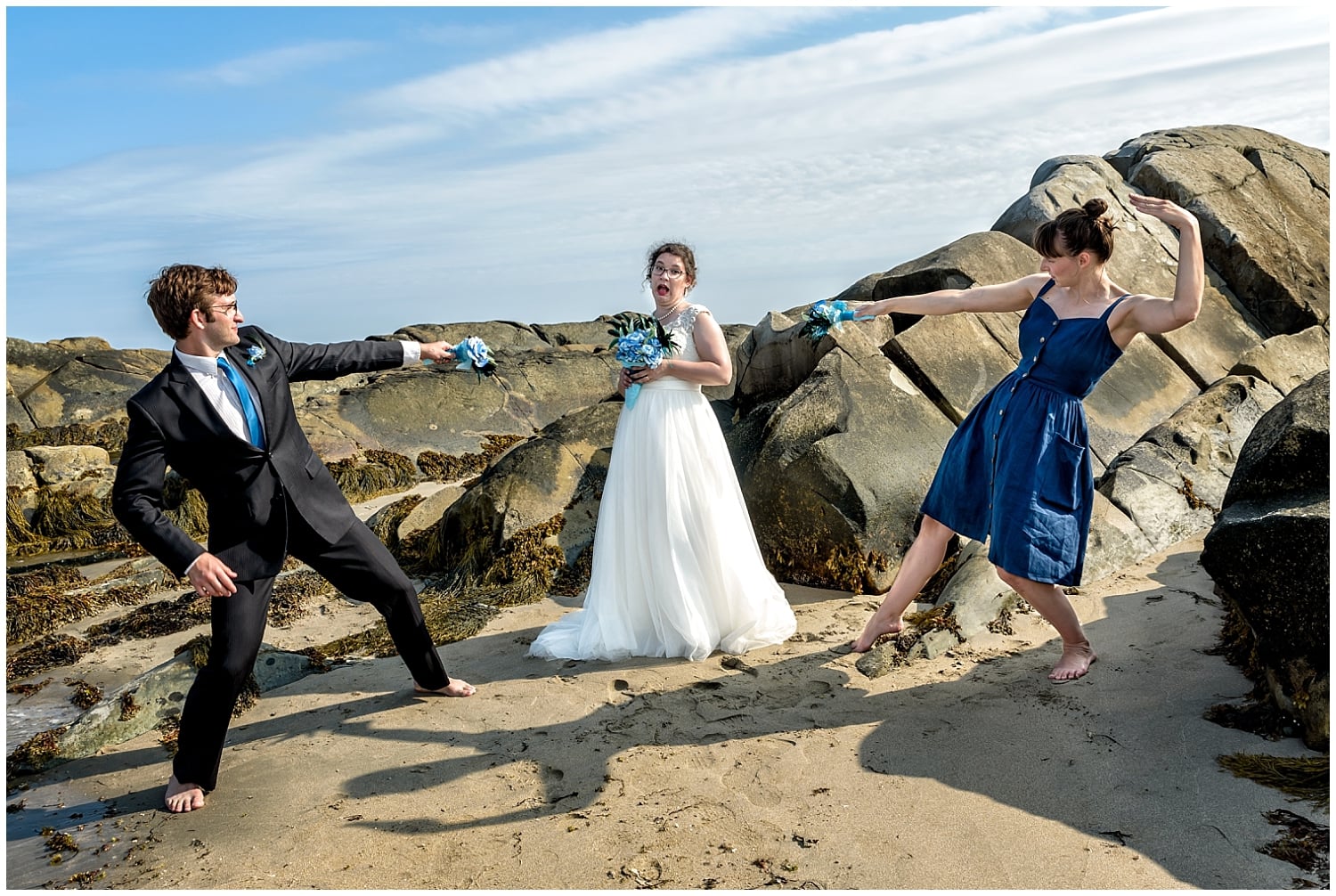 A Harry Potter themed wedding party photo pose during a beach wedding in Green Bay NS with the bride and bridesmaids.