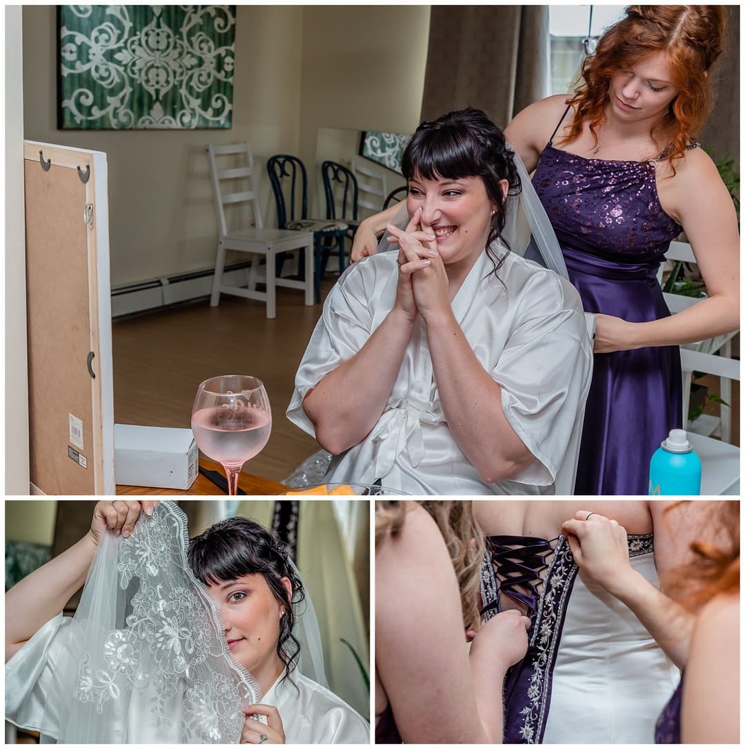 The bride gets her veil put on and her gown laced up by her bridesmaids during bridal prep in Halifax, NS.
