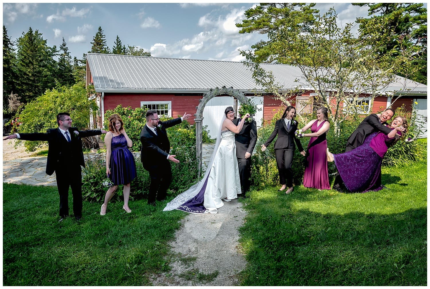 The wedding party have fun creating unqiue wedding photos for the bride and groom during their wedding at the Hubbard's Barn in Nova Scotia.