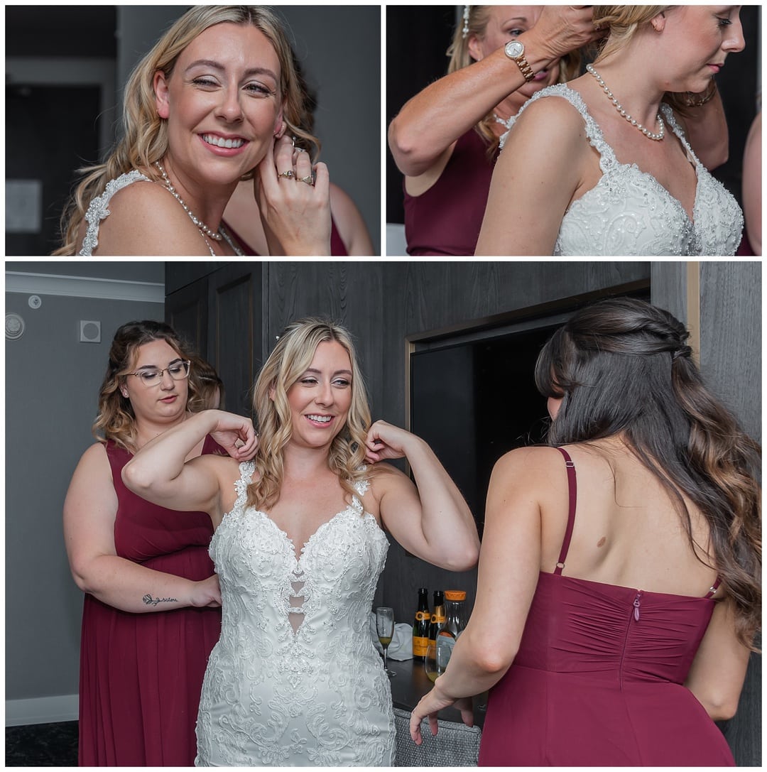 The bride puts on her wedding dress while her bridesmaids zip her up during bridal prep at the Sutton Hotel in Halifax.