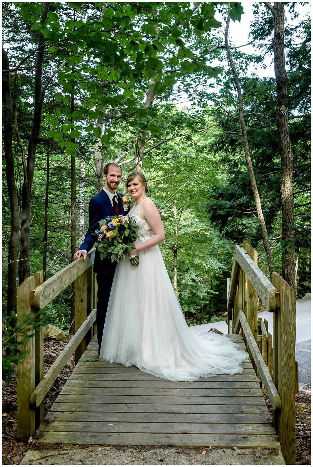 The bride and groom pose for their wedding photos in the forest surrounding Sir Sandford Fleming Park in Halifax, NS.