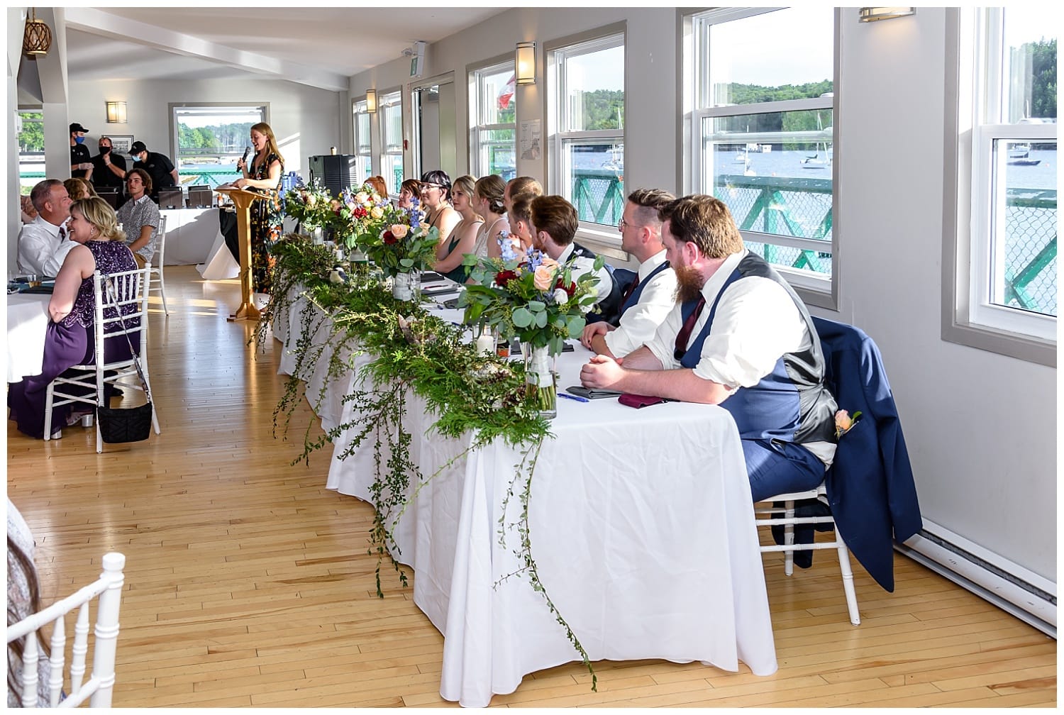 A MC announces the wedding party during a wedding reception at the St Mary's Boat Club in Halifax, NS.