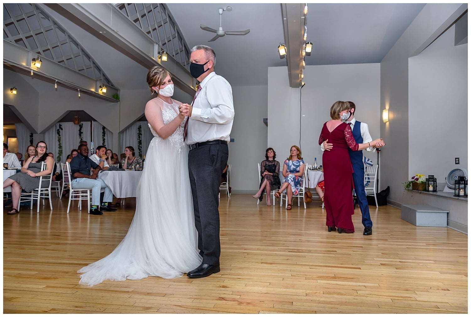 the father daughter and mother son dance done together during a wedding reception at the St Mary's Boat Club in Halifax, NS.