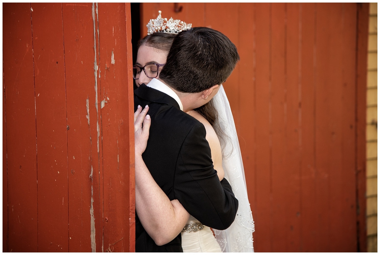 The bride and groom have a moment together after their first look at the Kinley Farm's barn in Lunenburg, NS.