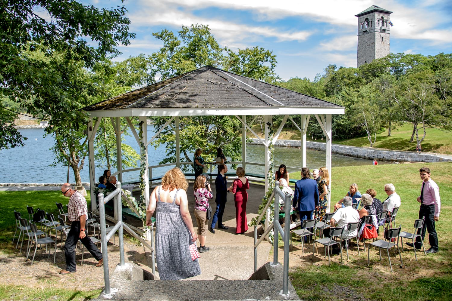 Sandra Adamson, a halifax wedding photographer, at work photographing a wedding at the Dingle Tower gazebo in Halifax, NS.