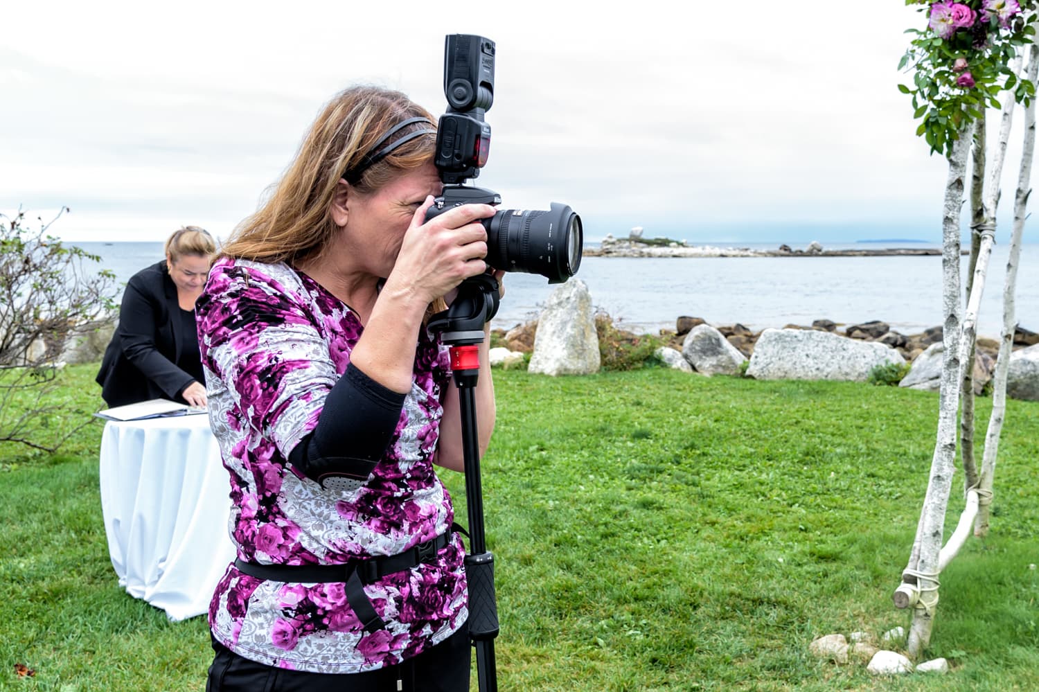 Sandra Adamson at work photographing a wedding ceremony at the Oceanstone resort in Nova Scotia.
