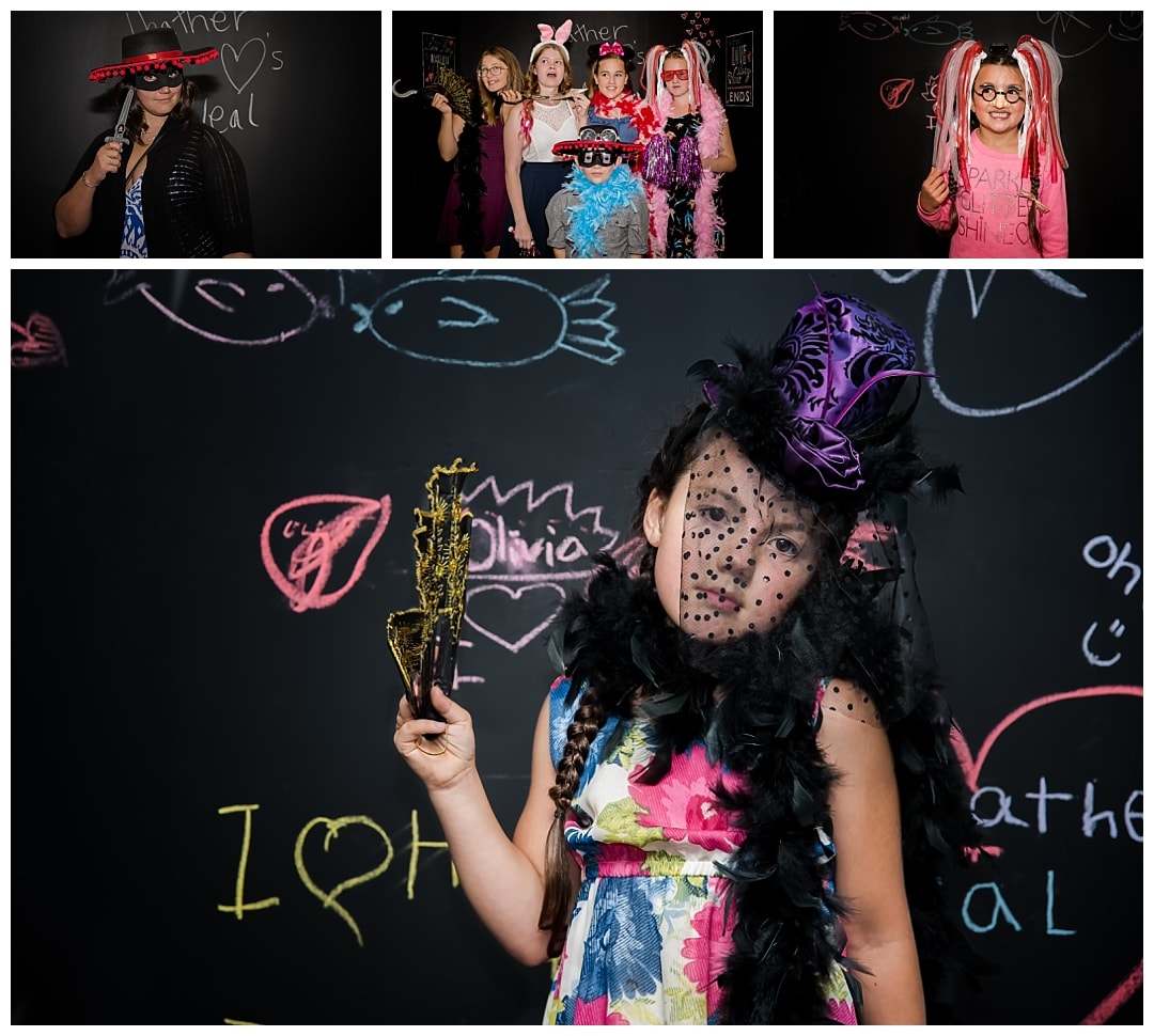 Guests dress up for a photo booth contest at wedding.