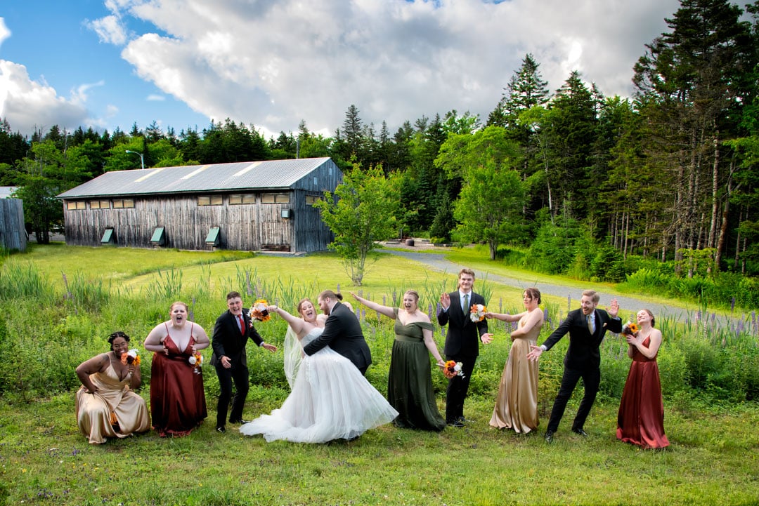 The wedding party having fun wedding photos taken with the bride and groom at Hatfield Farm in Halifax, NS.
