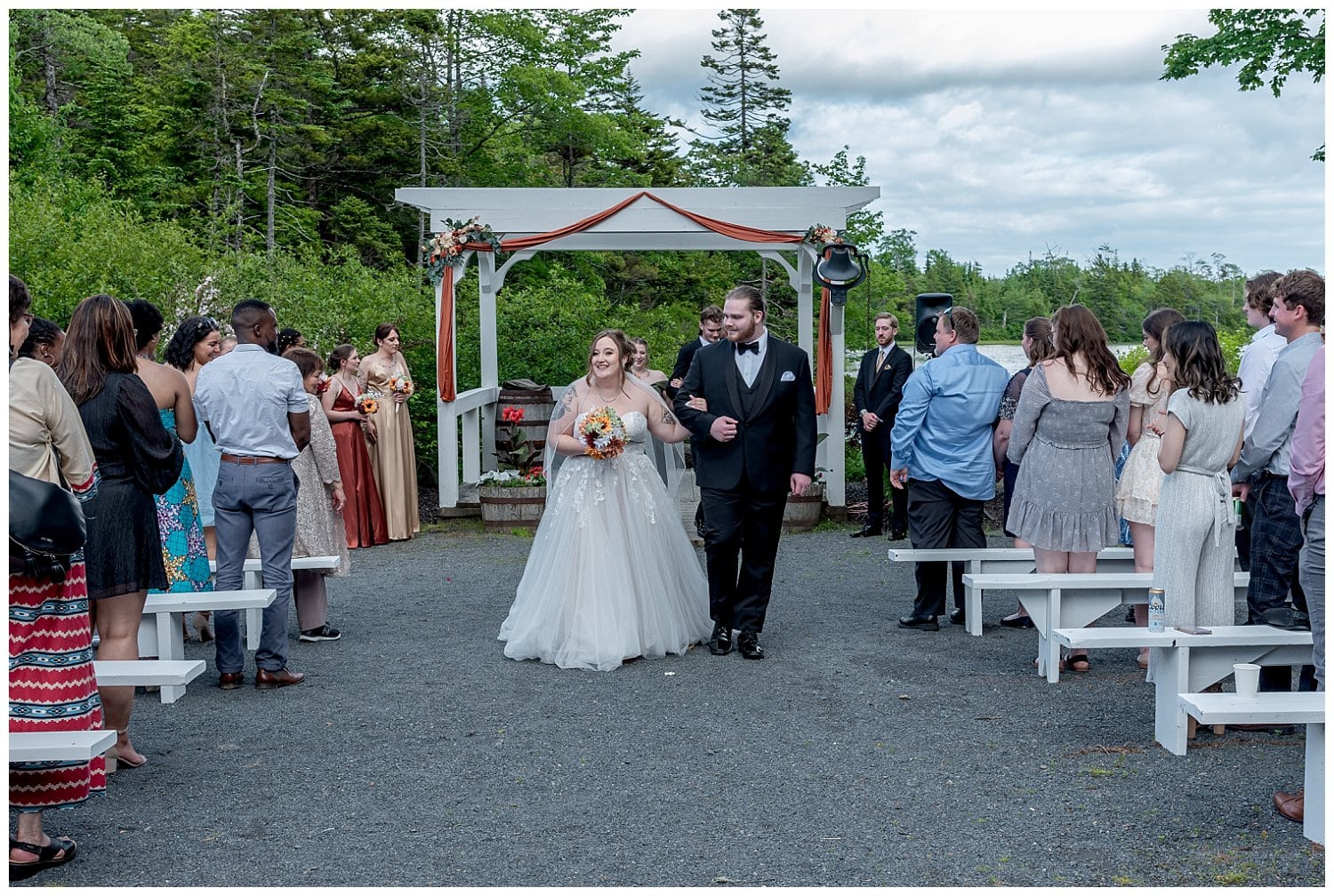 A bride and groom walk down the aisle after their wedding ceremony at Hatfield Farm in Halifax, NS.