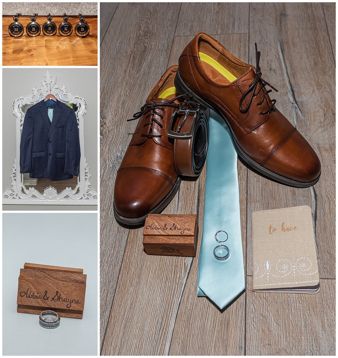 The groom's suit coat, shoes, tie and wedding rings.