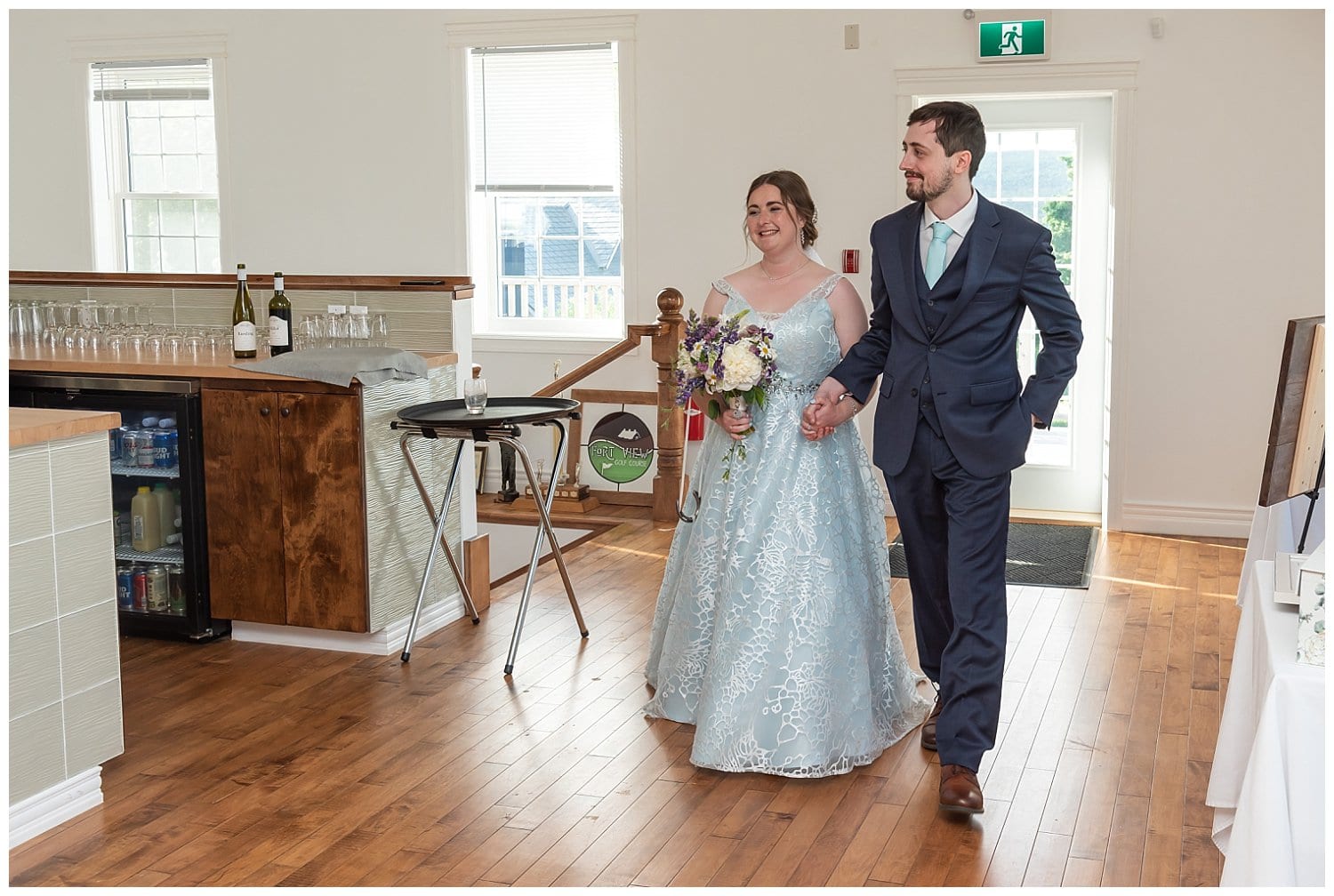 The bride and groom make their wedding reception entrance at the Founders House in Annapolis Royal, NS.