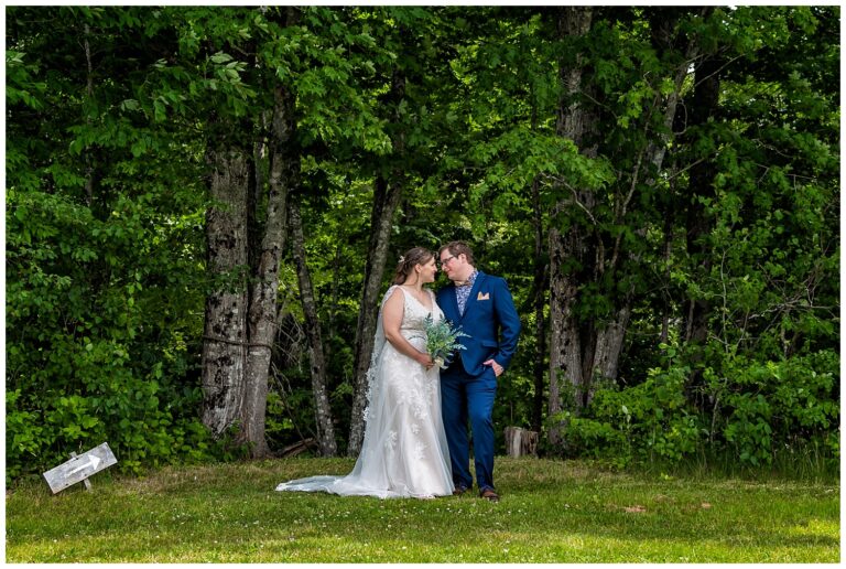 The bride and groom share a look together during their wedding photos at the Sadie Belle Farm.