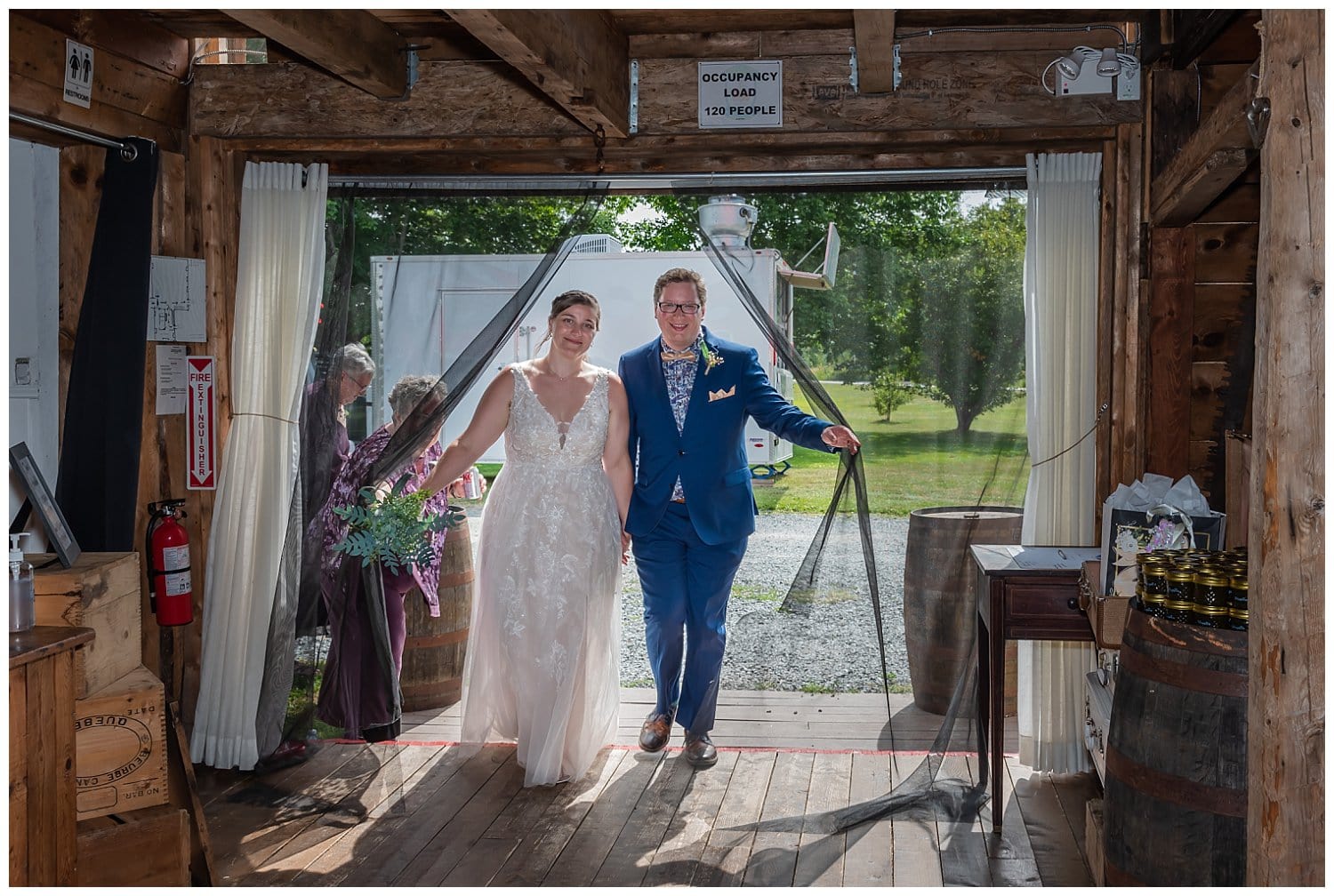 The bride and groom make their entrance to their wedding reception as husband and wife.