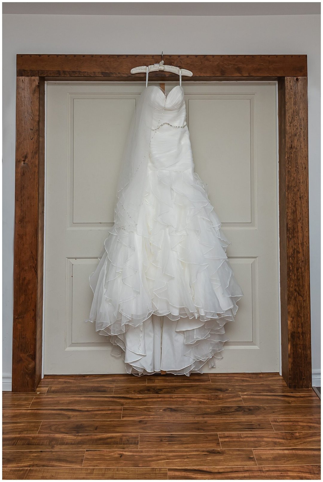 A beautiful mermaid style wedding dress with ruffles.