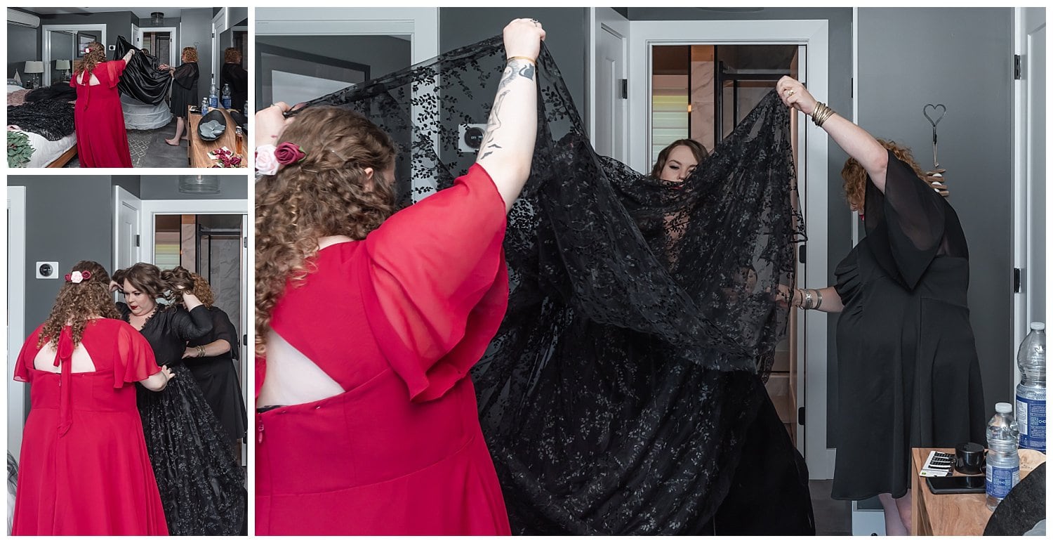 The bride gets help getting into her black wedding dress by her mother and sister at an Air BnB in Cape Breton.