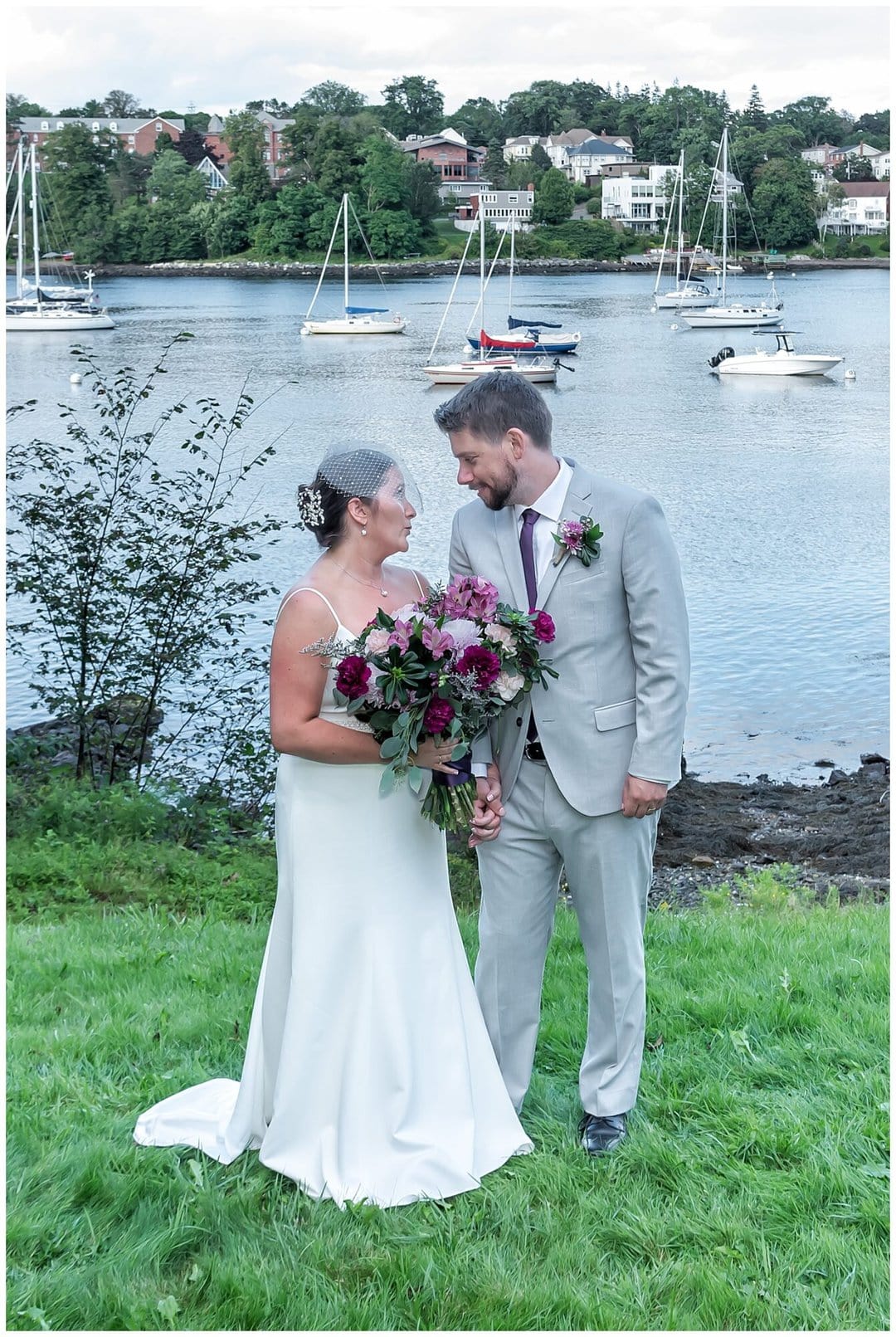 Bride and groom smile at each other during their wedding photos at Saraguay House in Halifax NS.