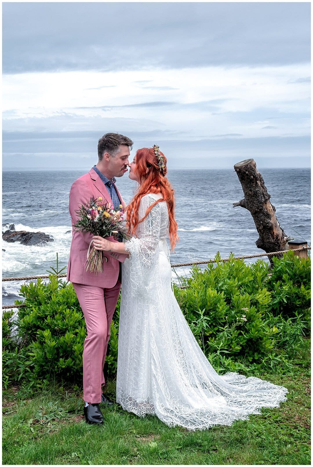The groom sticks his tongue out at the bride during their wedding photos at an Airbnb in Bear Cove, NS.