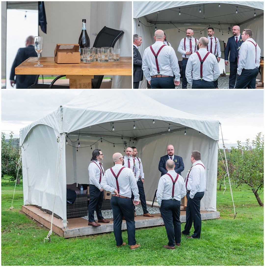 The groom spends time with his groomsmen in the groom's tent before the wedding ceremony at Bent Ridge Winery in NS.