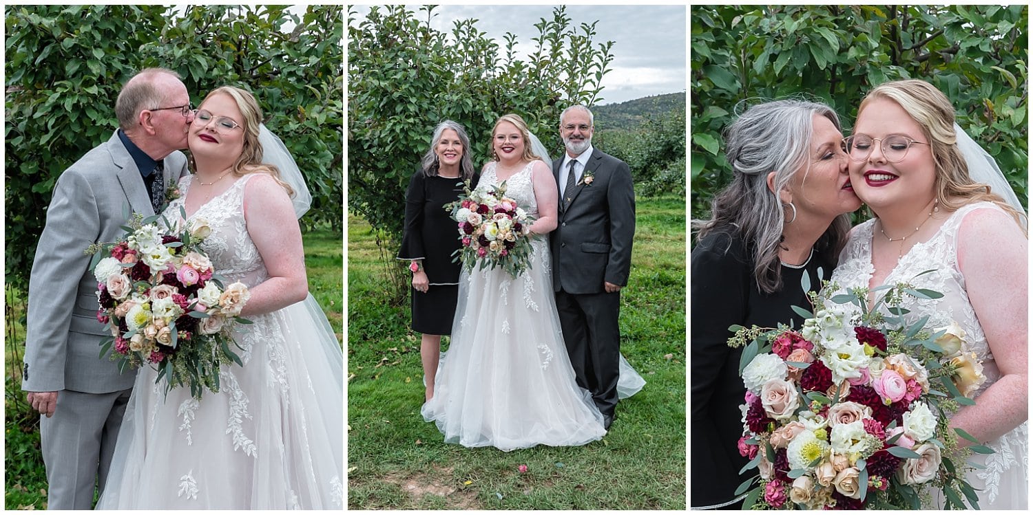 Mon and dad kiss their daughter during wedding family photos at Bent Ridge Winery in NS.