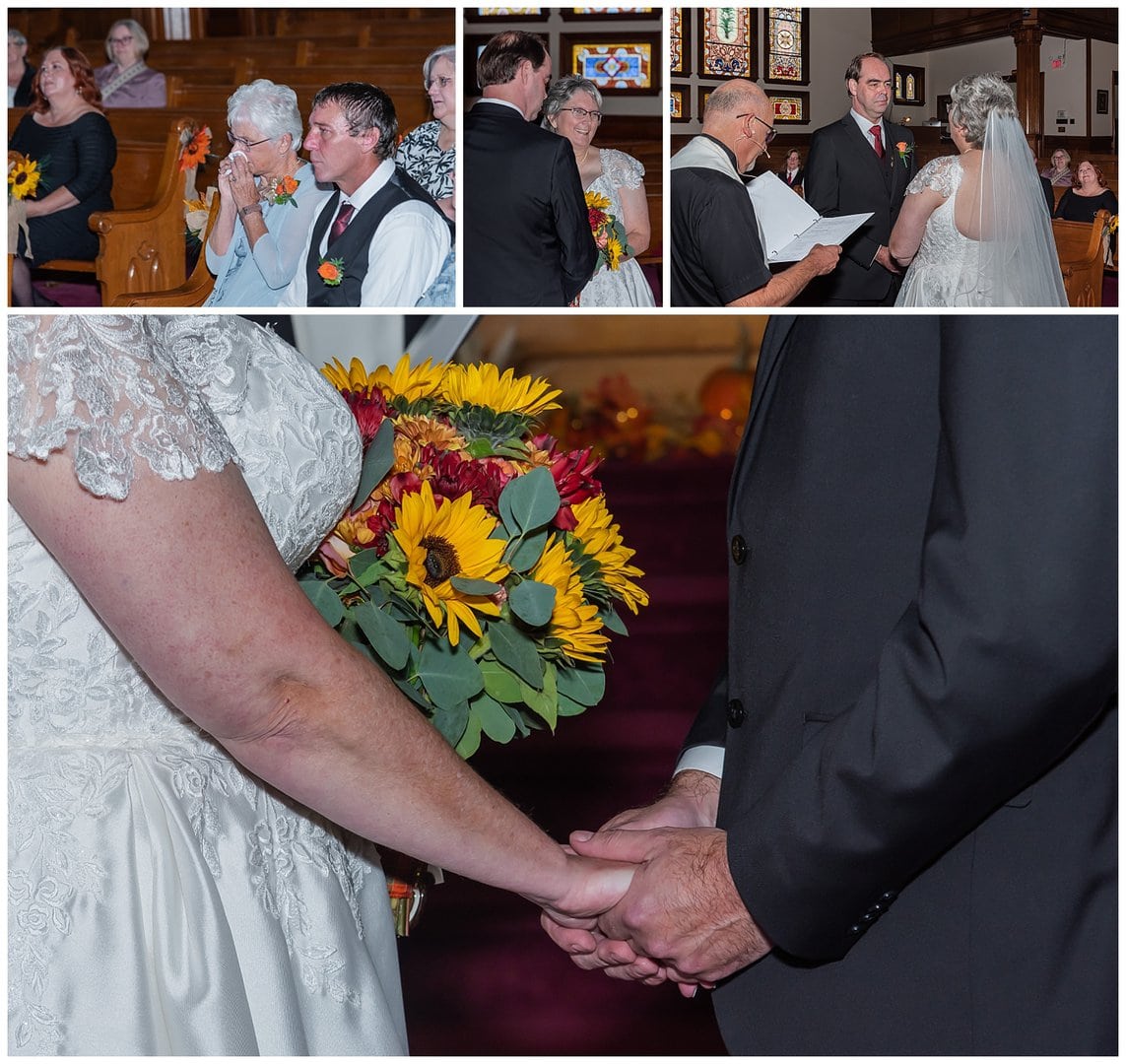 The bride and groom hold hands during their church wedding ceremony in Windsor NS.