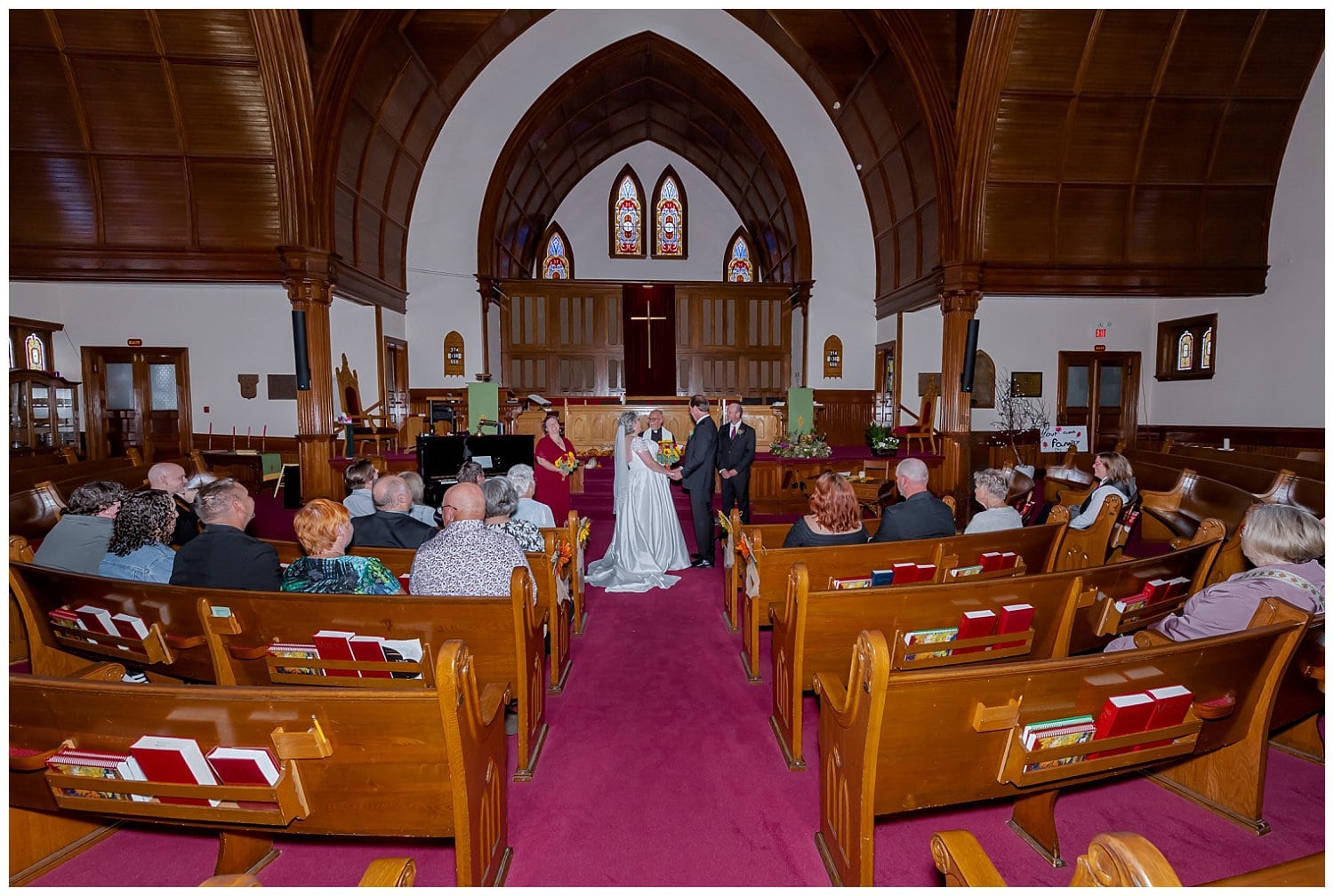 The bride and groom exchange vows during their church wedding ceremony in Windsor NS.
