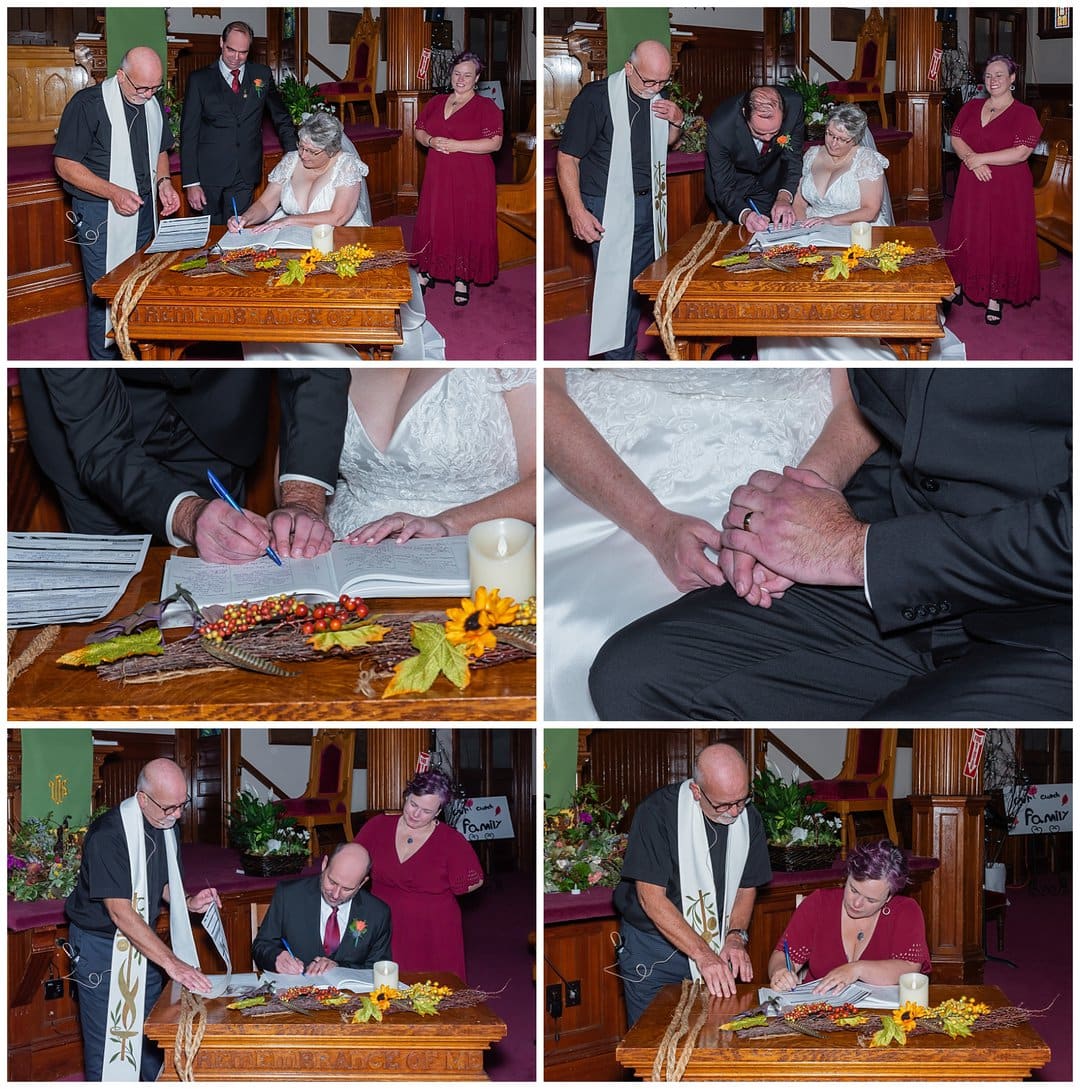 The bride and groom sign their marriage certificate during their wedding ceremony in Windsor NS.