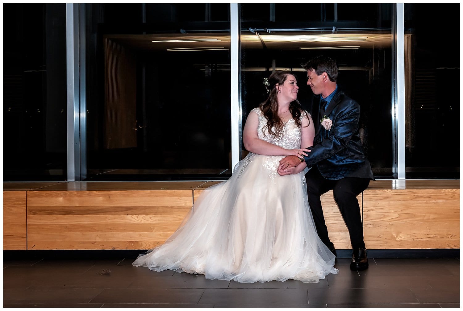 Bride and groom smile at each other during wedding photos at Alderney Gate in Dartmouth NS.