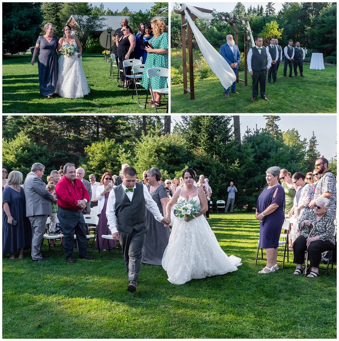 The bride's mother walks her up the aisle towards the groom for their wedding ceremony at Hubbards Barn in NS.