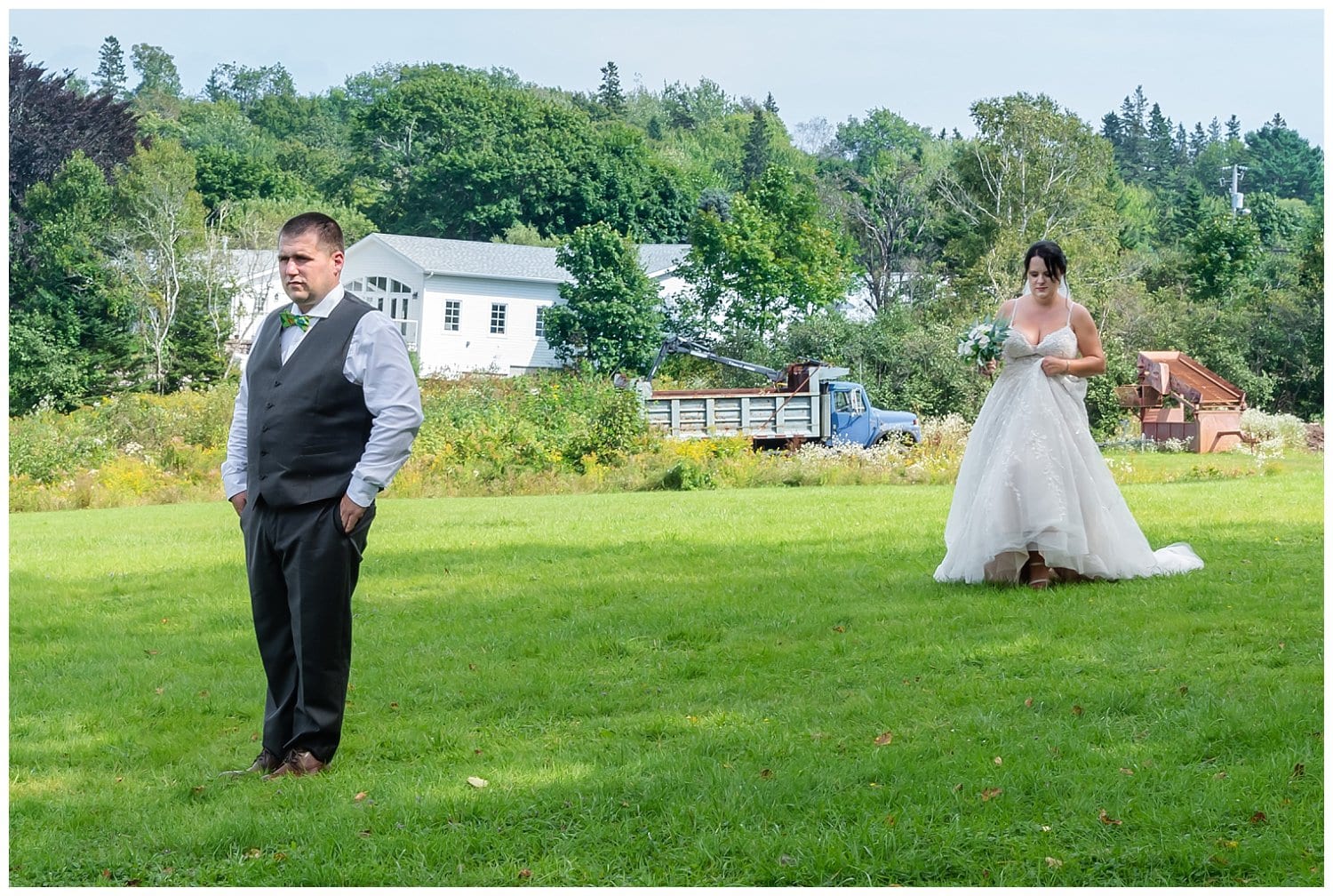 The bride walks towards her groom for their first look at an Airbnb in Hubbards NS.