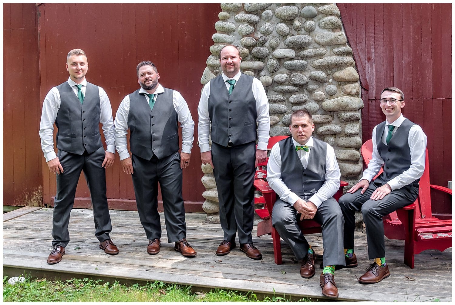 The groom and his groomsmen pose for wedding photos outside a rustic cabin in Hubbards NS.