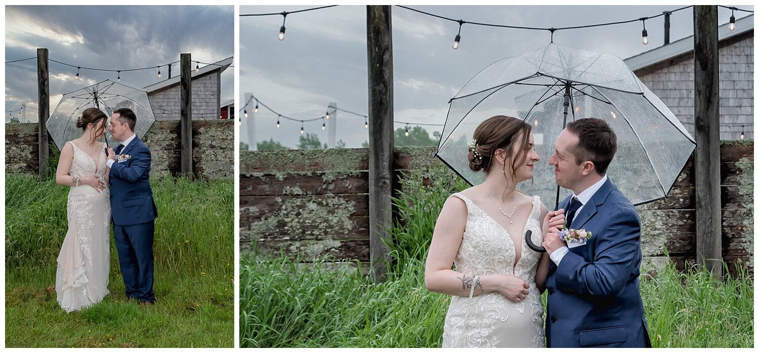 The bride and groom pose for wedding photos in the rain at Parker's Barn in Hopewell NS.