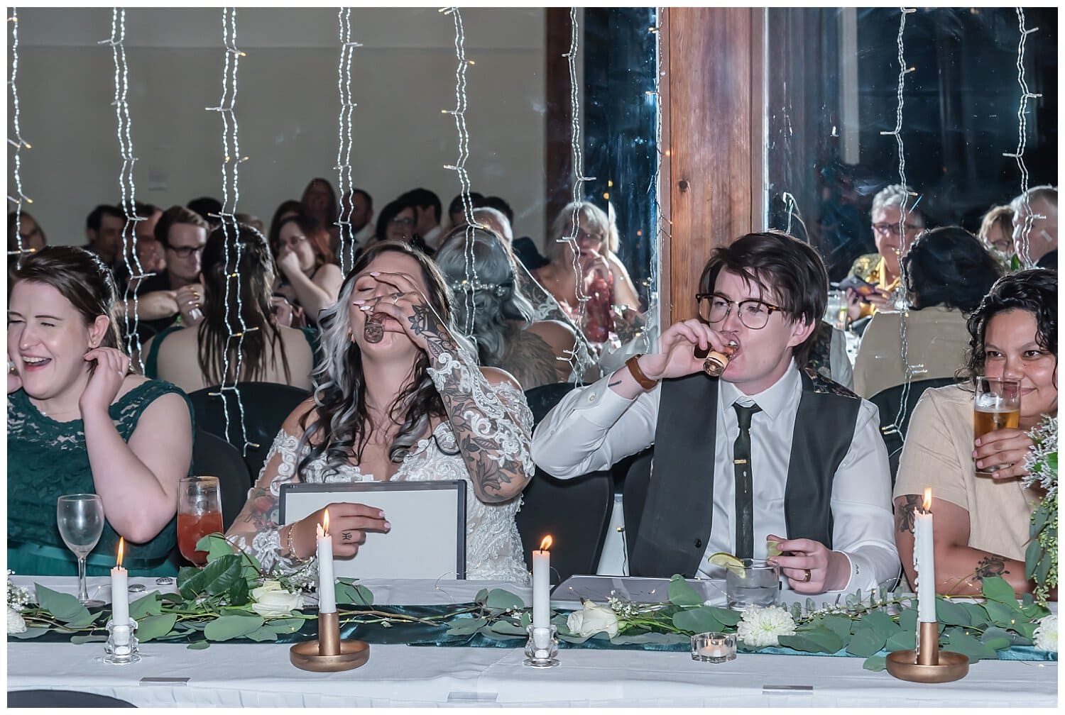 The bride and bride get the answer incorrect and have to take a tequila shot together during their wedding reception at Saraguay House in Halifax NS.