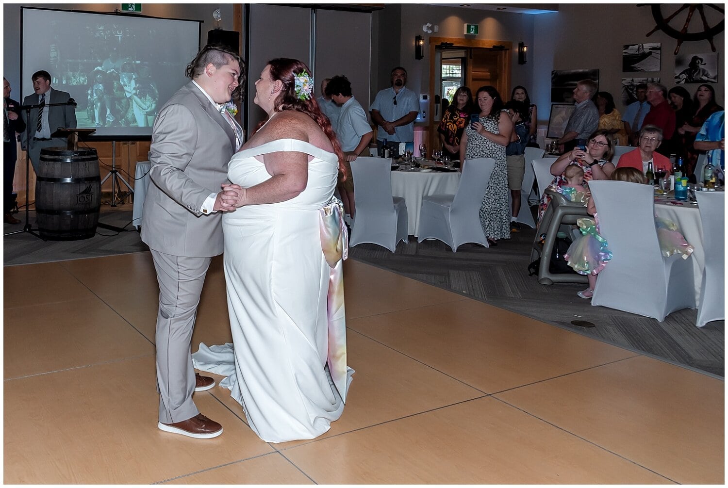 The brides share their first dance together during their wedding reception at White Point Resort in NS.