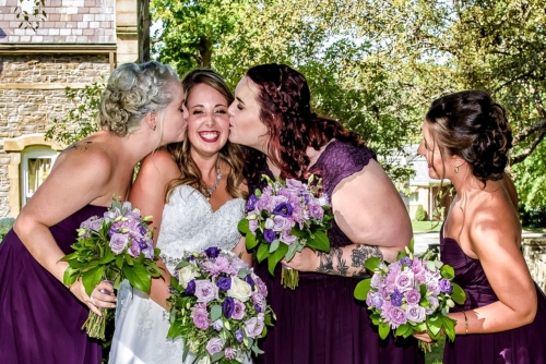 A bride with bridesmaids during wedding photos at Point Pleasant Park in Halifax.