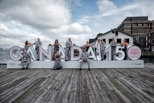 The bride and groom posing during wedding party photos in the Historic Properties in Halifax.